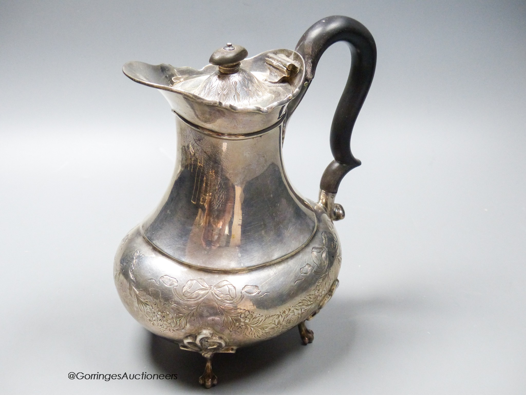 An Edwardian silver hot water pot, Goldsmiths & Silversmiths Co Ltd, London, 1909, gross 20oz.